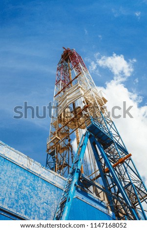 Land oil drilling rig blue sky