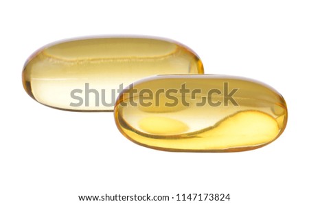 Close up of food supplement oil filled capsules suitable for: fish oil, omega 3, omega 6, omega 9, evening primrose, borage oil, flax seeds oil, vitamin A, vitamin D, vitamin D3, vitamin E