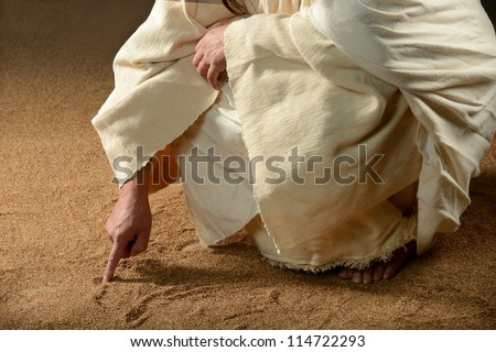 Jesus Writing on the sand with his finger Royalty-Free Stock Photo #114722293