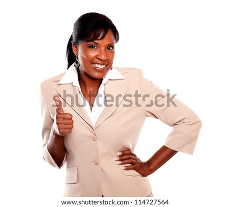 Charming businesswoman lifting the fingers up and looking at you on isolated background