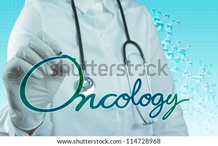 Doctor with a stethoscope writing oncology as medical concept Royalty-Free Stock Photo #114728968