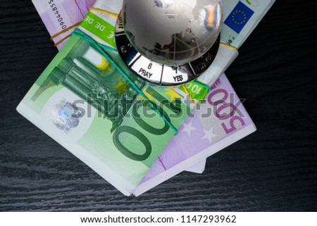 glass earth with choice yes or no or pray, and big amount euro cash
