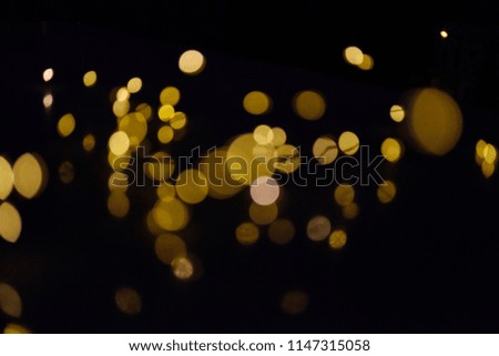 Gold bokeh on a dark background, abstraction, background