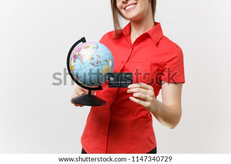 Portrait of business teacher woman in red shirt skirt glasses holding globe and credit card isolated on white background. Education teaching in high school university, tourism, study abroad concept Royalty-Free Stock Photo #1147340729