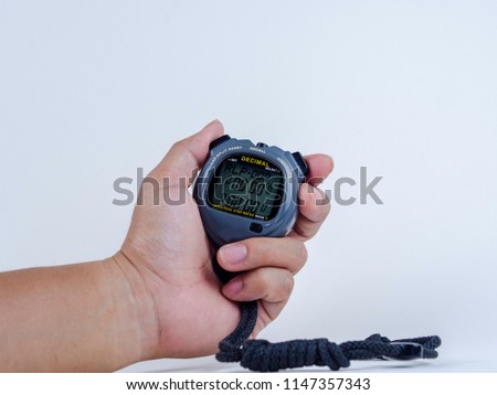 Hand hold the stop watch in the white background