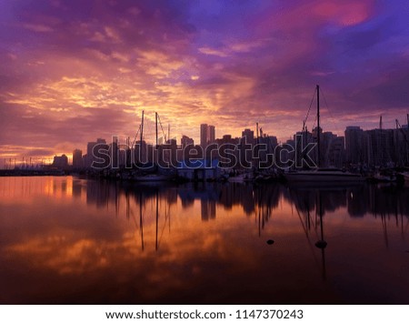 Vibrant Foggy Sunrise Over Vancouver City Downtown and Harbour        