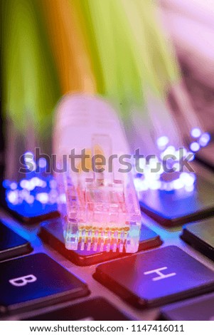 network cable closeup with fiber optical background