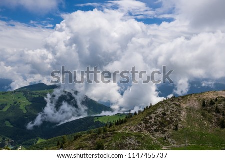 Clouds over the mountains. Mountain landscape before the rain.
