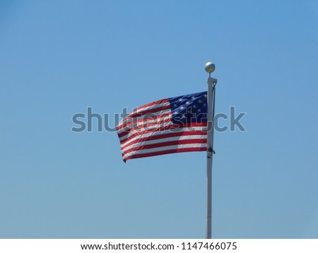 13 stared american flag ruffling in the wind