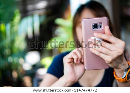 woman using mobile phone or smartphone with copy space.