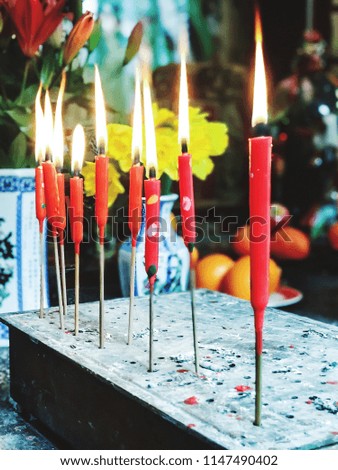Red candlestick on fire in the Chinese temple.