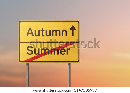 autumn summer - yellow road sign with inscriptions 