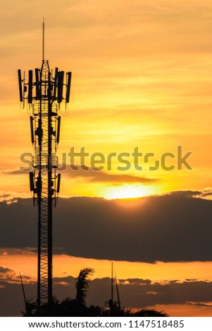 silhouette of telecommunication tower when sunset beautiful on sky background