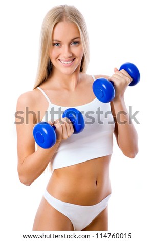 Beautiful fitness girl with dumbbells isolated on white