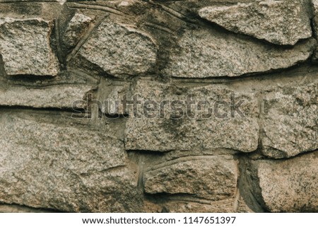Background in the form of stones in a concrete wall