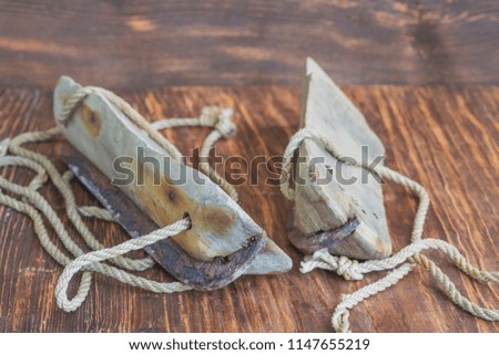 Old wooden skates on  table