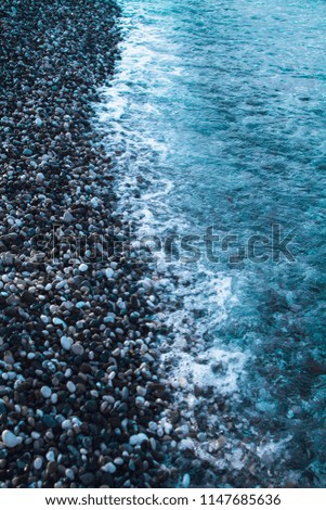 Blue water of the Mediterranean Sea. Rocky shore.