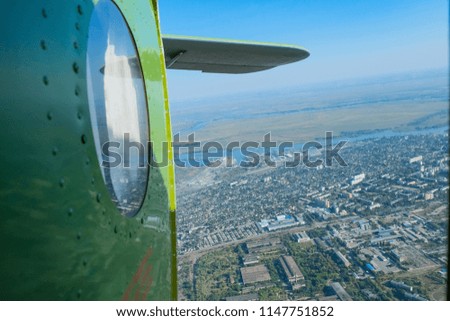 photos from the aircraft with a view of the earth and a fuselage with wings