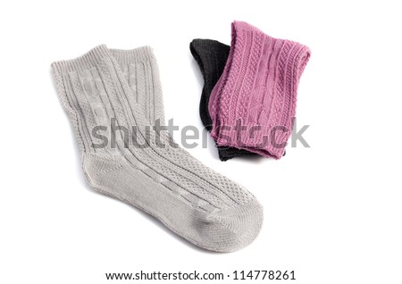 three pairs of socks of different colors, isolated on white