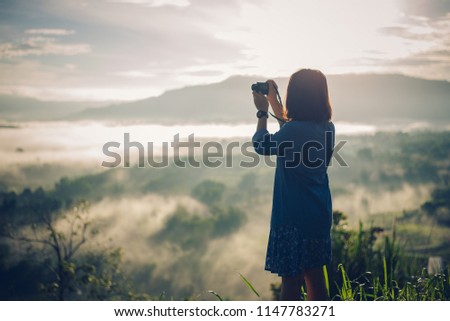 Photographer take a picture at Mountain with foggy sunrise. View from the scenic Khao Takian Ngo-Khao Kho-Phetchabun Thai land.