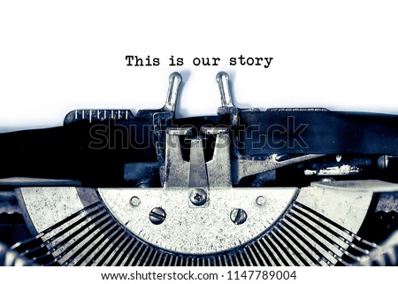close up image of typewriter with paper sheet and the phrase:This is our story. copy space for your text. retro filtered Royalty-Free Stock Photo #1147789004
