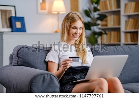 Beautiful woman using credit card for online shoping Royalty-Free Stock Photo #1147797761