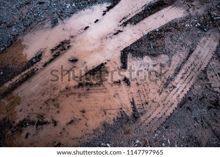 Tyre track on dirt sand or mud, Picture in retro or grunge tone. Car drive on sand. off road track.