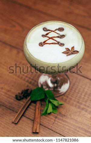 creative home cocktail at wooden brown background vertical