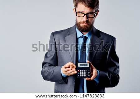     business man with a calculator                           