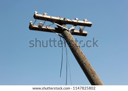 Old wooden electric pole