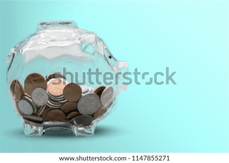 Piggy bank and coins on background