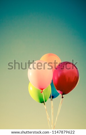 Multicolor balloons background,concept of happy birth day in summer and wedding honeymoon party (Vintage color tone)