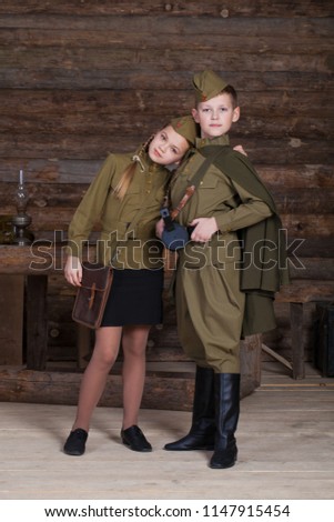 Two children in military uniforms of the Great Patriotic War. World War II