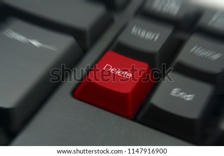 red delete keyboard button with motion blur effect