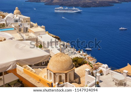 View on boats and volcano island from Thira town. Santorini, Greece.