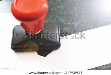 Office paper document stamp with Business cards lying around
