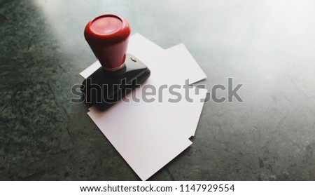 Office paper document stamp with Business cards lying around
