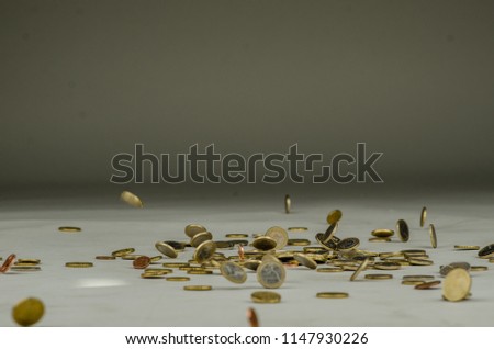 Euro coins falling, money raining on grey background