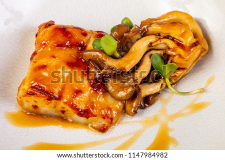 Halibut with mushroom and orange sauce