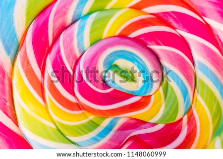 Abstract Design Rainbow Tie Dye Colors in Swirl Pattern in Large Lollipop Sucker Royalty-Free Stock Photo #1148060999