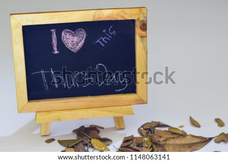 I love Thursday written on a chalkboard. Autumn seasonal flat lay photo on White background