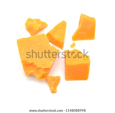 Cubes of cheddar cheese isolated on white  Royalty-Free Stock Photo #1148088998