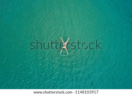 girl swims from the sea