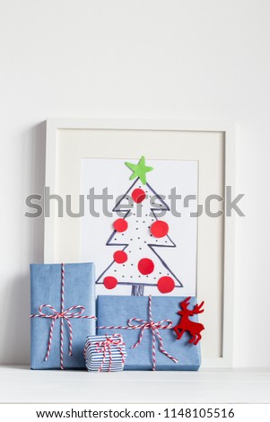 Child handmade Christmas tree illustration and gift boxes. Christmas concept.