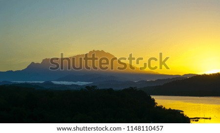 The landscape picture of Mountain Kinabalu and river during sunrise at Kota Kinabalu,Sabah Borneo,Malaysia.