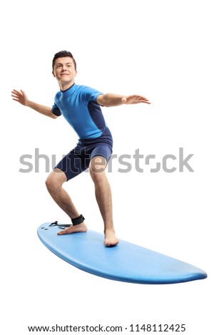 Full length portrait of a teenage boy surfing isolated on white background