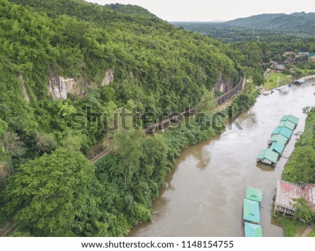 Aerial shot of death railway along a river in Kanchanaburi, Thailand