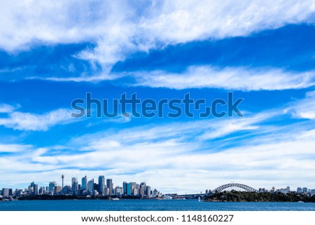 Sydney building horizon view from ocean with blue sky