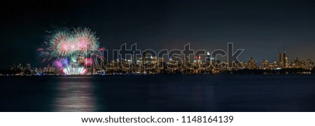 panorama of fireworks with cityscape