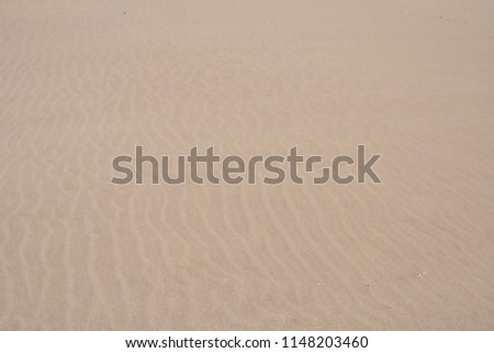 Photo picture closeup sand texture pattern of a beach in the summer